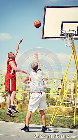 Two basketball players on the court