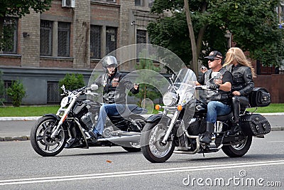 Two biker riding on the road