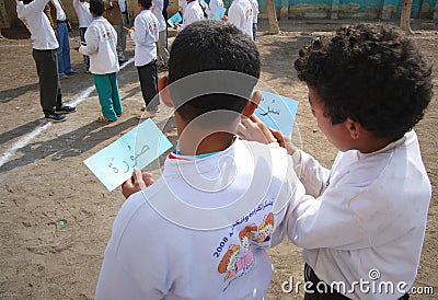 Two boys friends playing words game at school