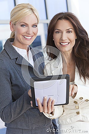 Two Businesswomen or Women Using Tablet Computer