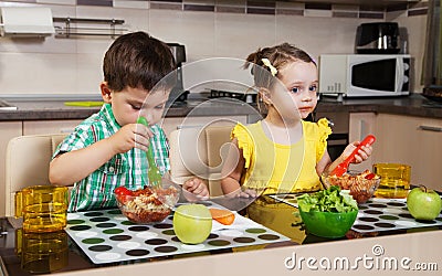 Two children who eat healthy food