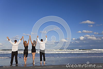 Two Couples, Arms Up Celebrating On Beach