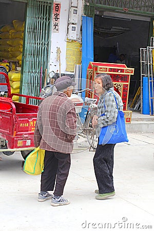 Two elderly Chinese women meet in Xingping,China