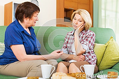 Two female having serious conversation