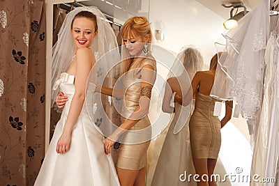 Two girlfriends in bridal Boutique