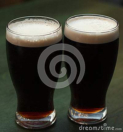 Two glasses of dark beer