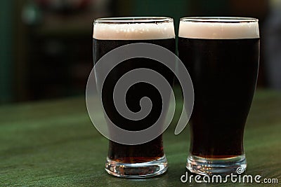 Two glasses of dark beer