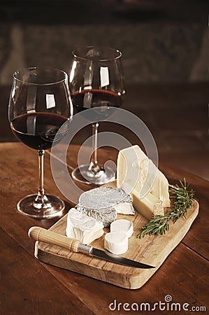 Two Glasses Of Red Wine And Cheese