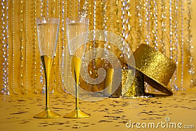 Two Gold Champagne Flutes with Sequined Party Hats