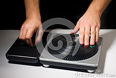 Two hands on DJ Turntable Game