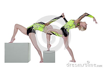 Two high skill woman as gymnast dance on cube