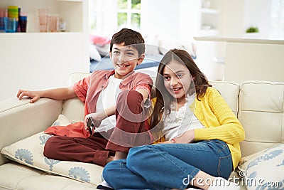 Two Hispanic Children Watching TV Together