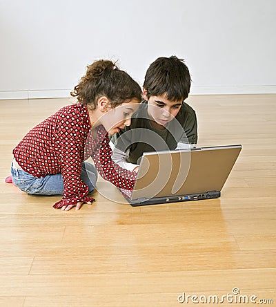 Two kids with laptop computer