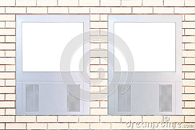 Two led displays on brick wall