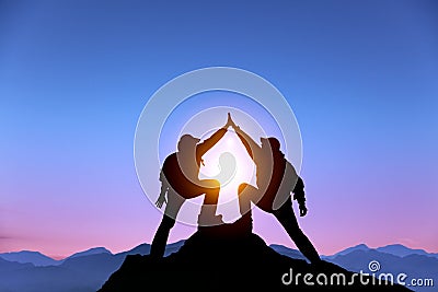 Two man with success gesture on the mountain