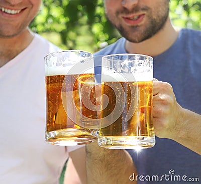 Two men with glasses of the light beer