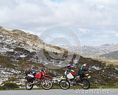 Two motor cycles in the Snowy mountains