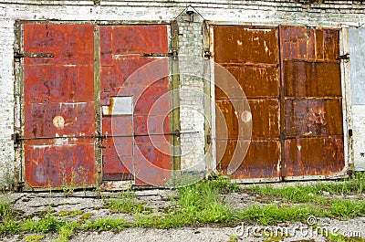 Two old and rusted garage doors