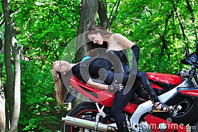 Two passionate girl on sports bike