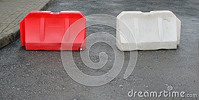 Two plastic road barriers