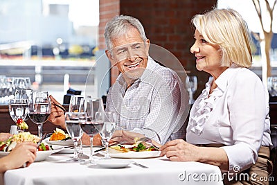 Two seniors eating out