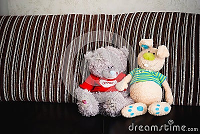 Two soft toys, bear and rabbit
