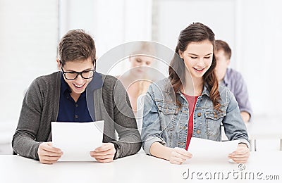 Two teenagers looking at test or exam results