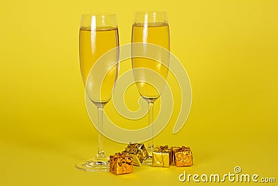 Two wine glasses with champagne and small bright
