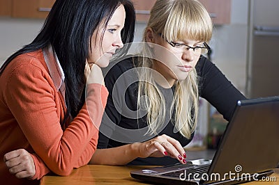 Two women on laptop
