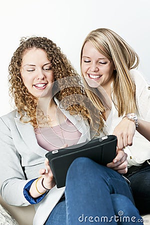 Two women using tablet computer