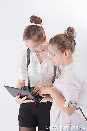 Two women working with laptop