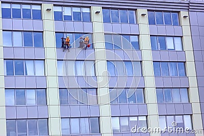 Two Workers Washing A Skyscraper Windows