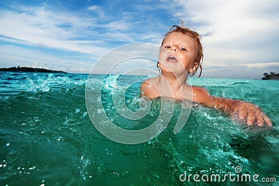 Two year old kid swimming