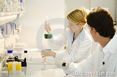 Two young researchers at work