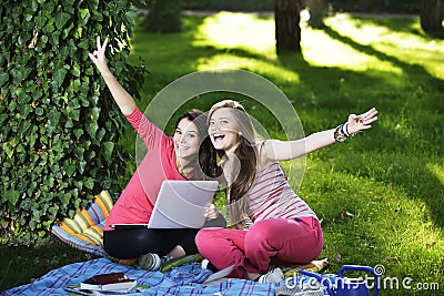 Two young woman with the laptop