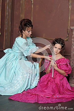 Two young women in retro dresses