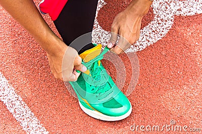 Tying sports shoe