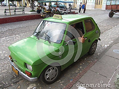 Typical Cuban Taxi and taxi-driver thumb