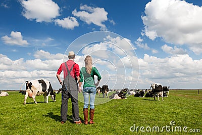 Typical Dutch landscape with farmers couple