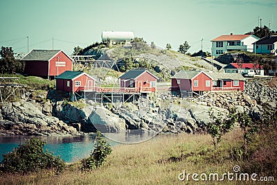 Typical Norwegian fishing village with traditional red rorbu hut