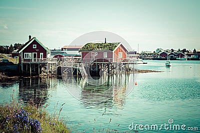 Typical Norwegian fishing village with traditional red rorbu hut