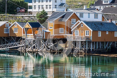 Typical Norwegian fishing village with traditional red rorbu hut