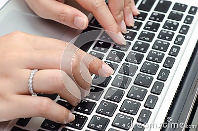 Typing on keyboard. female finger