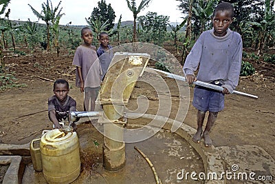 Ugandan Children fetch water at water pump