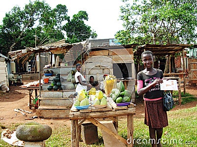 Ugandan women selling local fruit on road side