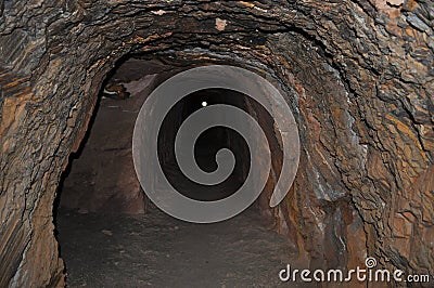 Underground drive mine mining with light in tunnel
