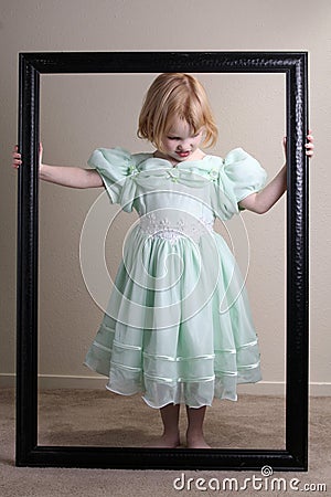 Unhappy Little girl green dress framed