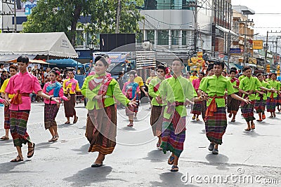 Unidentified dancers perform traditional Thai-Esan dance on the traditional candle procession festival of Buddha.