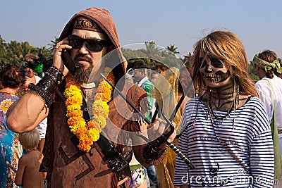 Unidentified man and woman in carnival costumes at the annual festival, Arambol beach, Goa, India, February 5, 2013.