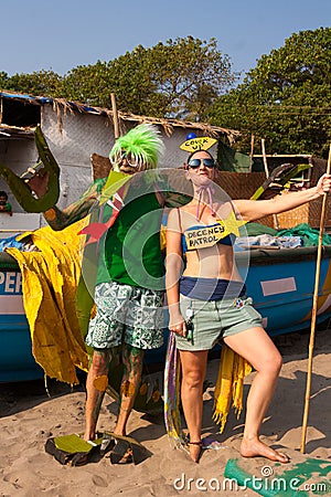 Unidentified man and woman in strange costumes at the annual festival of Freaks, Arambol beach, Goa, India, February 5, 2013. Tour